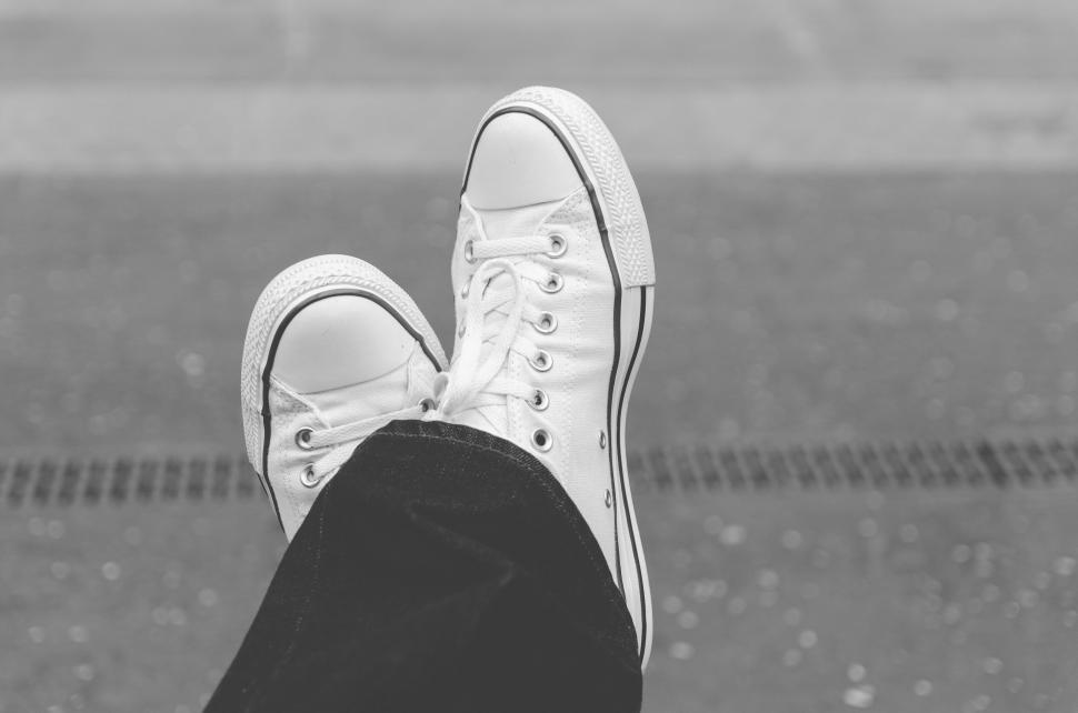 Free Image of Casual sneakers on a person s feet 