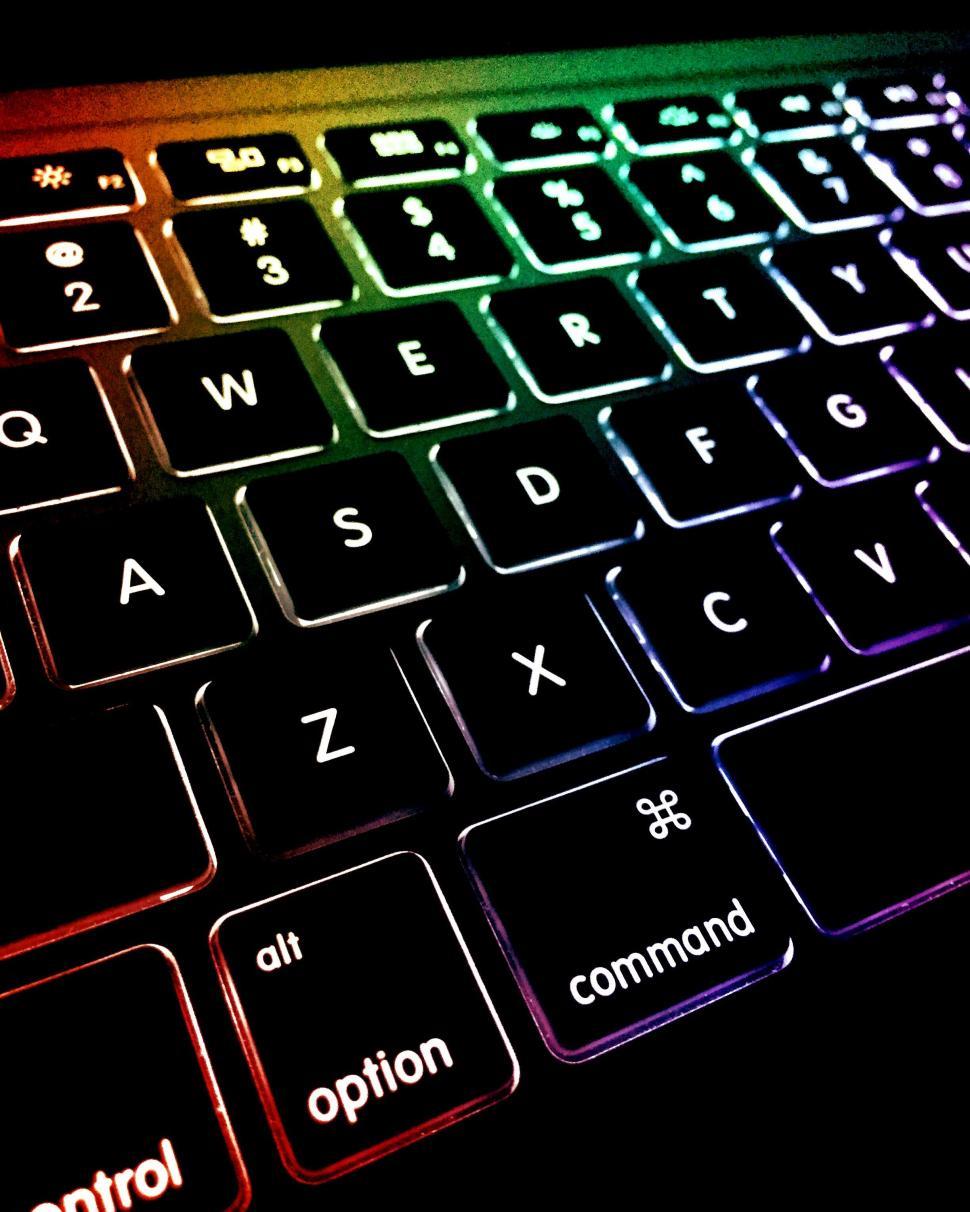 Free Image of Illuminated colorful laptop keyboard close-up 