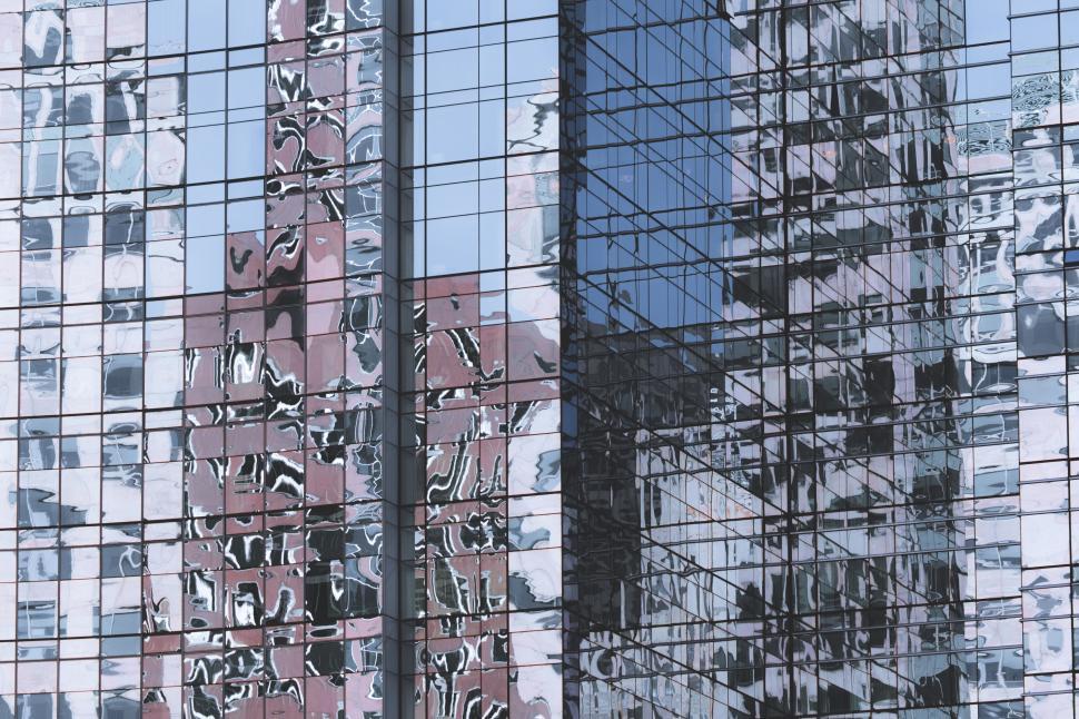 Free Image of Wavy reflections on blue glass facade 