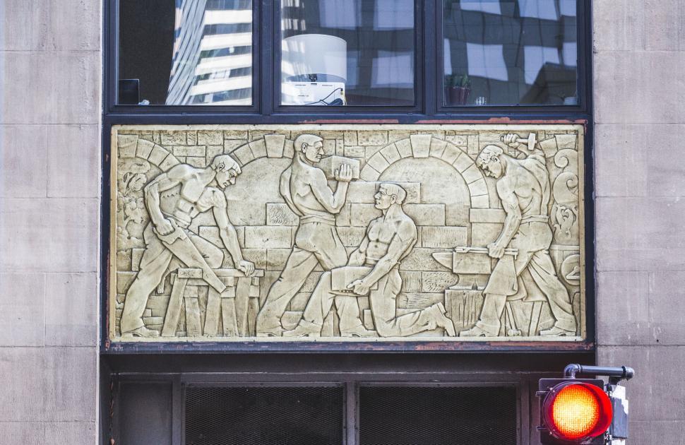 Free Image of Relief sculpture on a building in city setting 