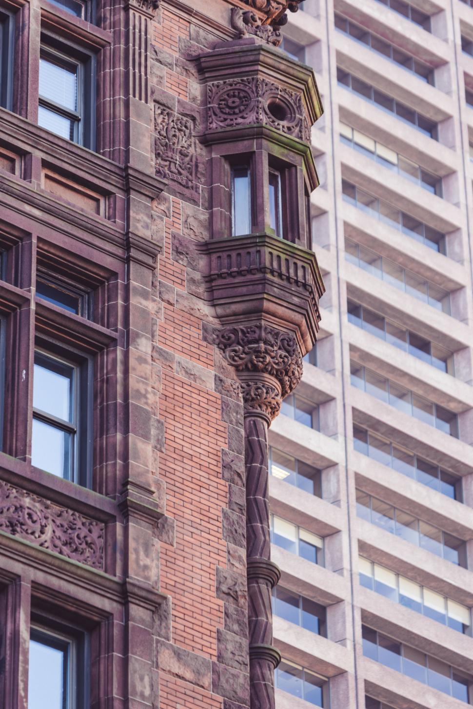 Free Image of Ornate Victorian architecture with modern backdrop 