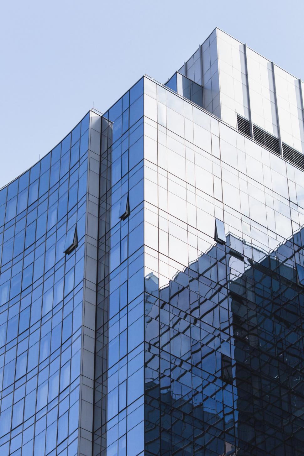 Free Image of Modern glass skyscraper facade close-up view 