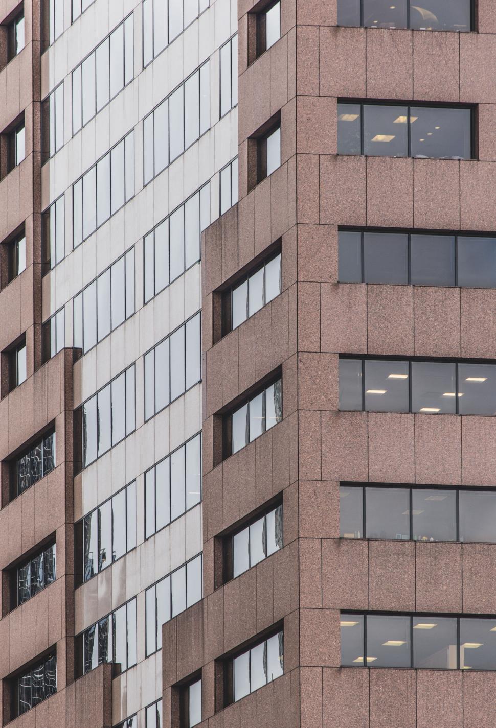 Free Image of Reflective glass building facade pattern 