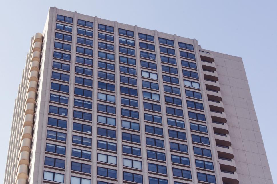 Free Image of Blue-tinted high-rise building with sky 