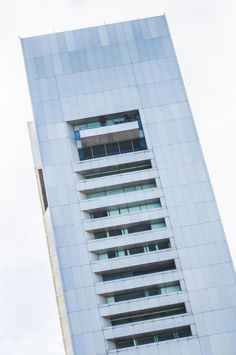 Free Image of Modern blue glass building facade closeup 