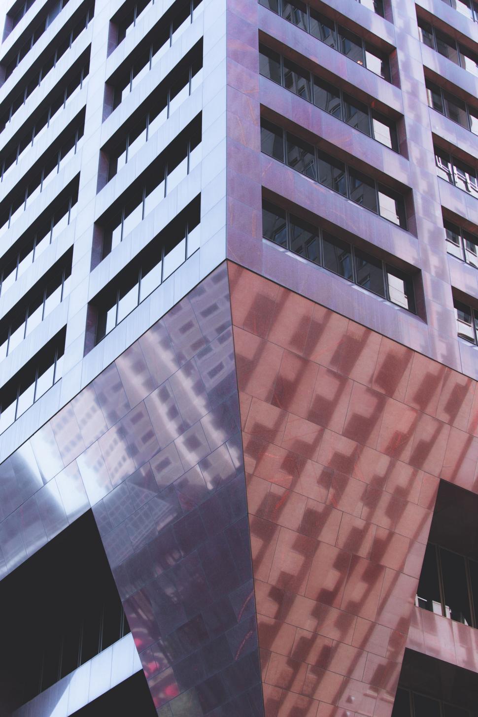Free Image of Contemporary building with a red metallic facade 