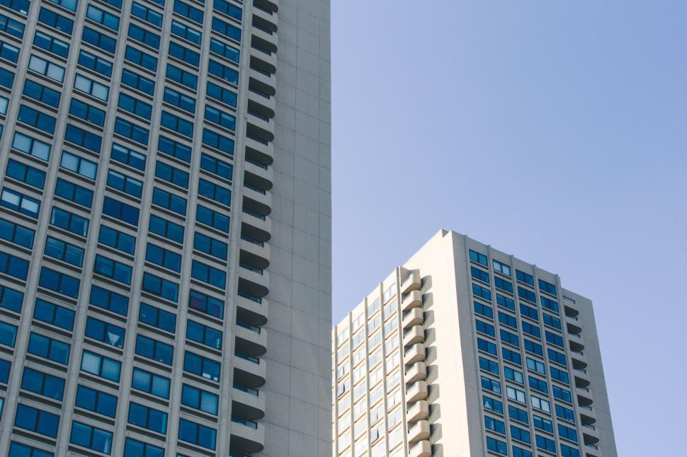 Free Image of Two-toned urban buildings against blue sky 