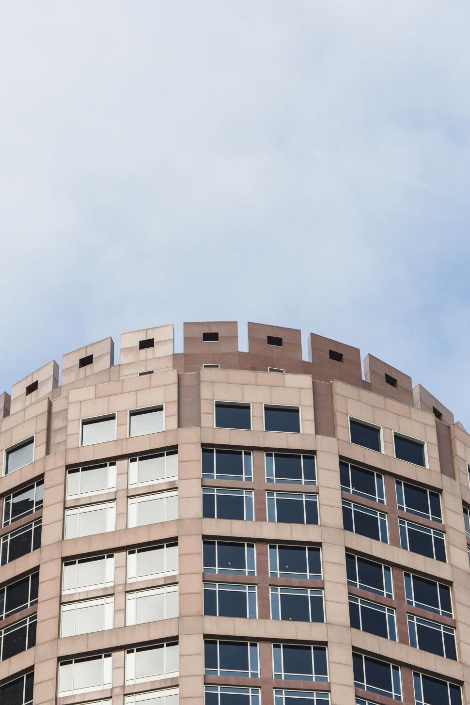 Free Image of Curved building facade with a glass exterior 