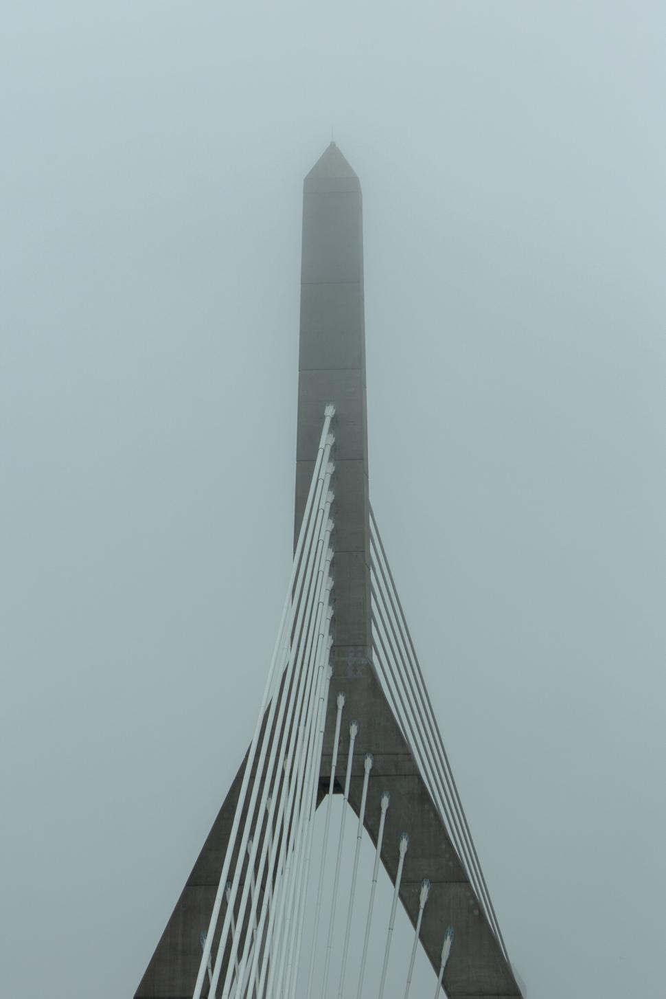 Free Image of Misty bridge tower rising into fog 