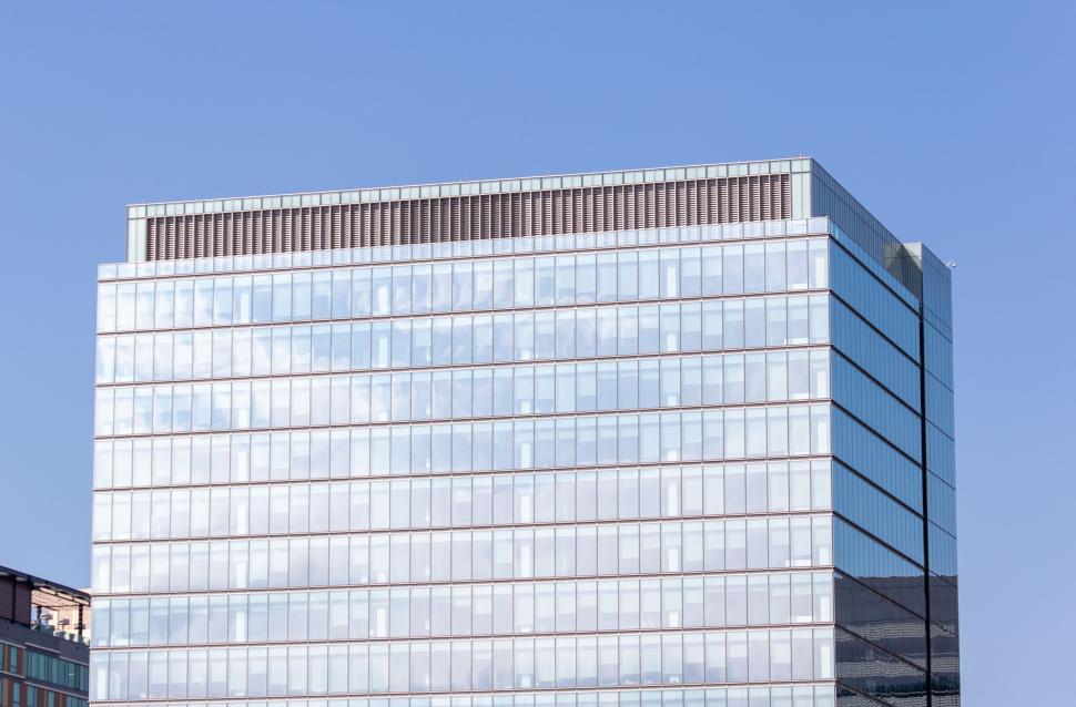 Free Image of Modern glass office building against blue sky 