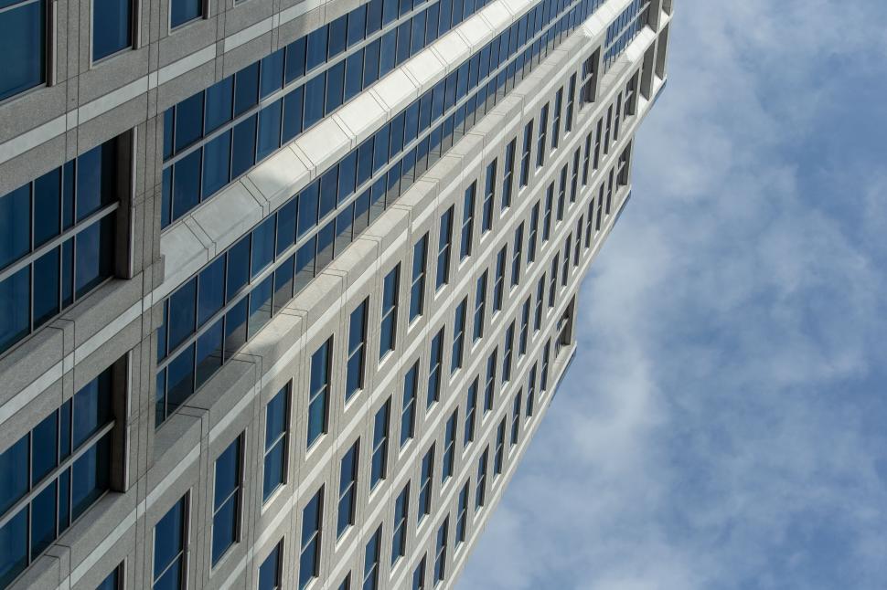 Free Image of Upward view of an imposing office building 
