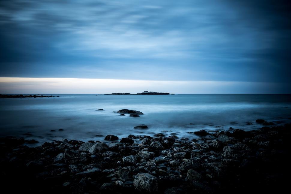 Free Image of Serene seascape with long exposure rocks 
