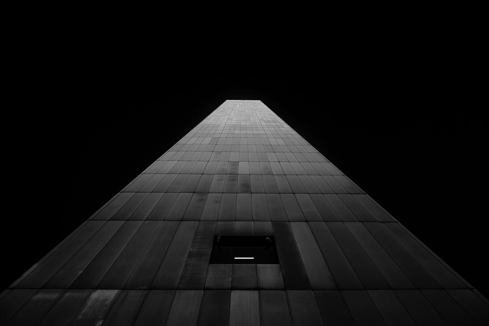 Free Image of Upward view of a tall building in monochrome 