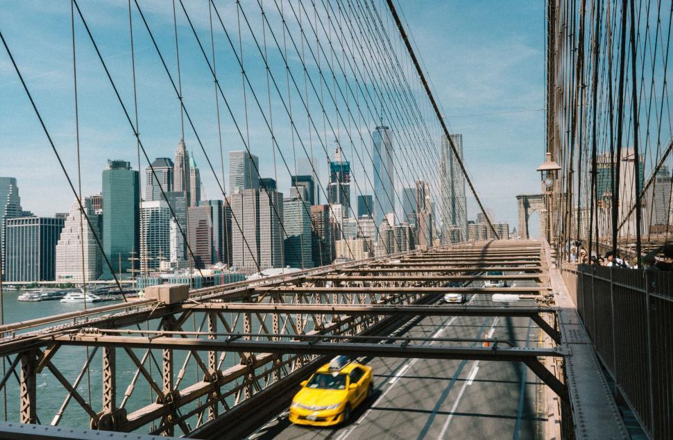 Free Image of Iconic bridge with a yellow taxi in the city 