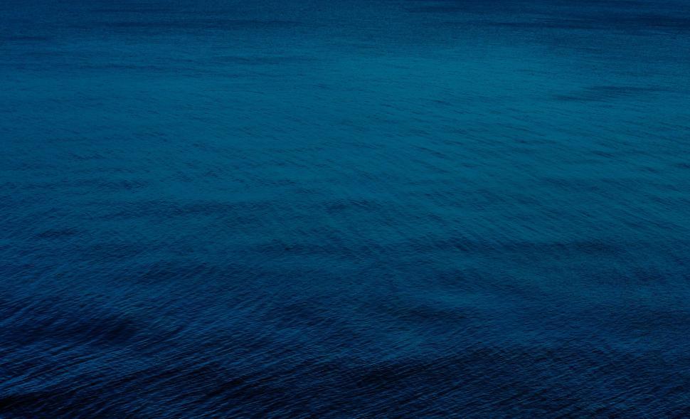 Free Image of Dark blue textured ocean surface under moonlight 
