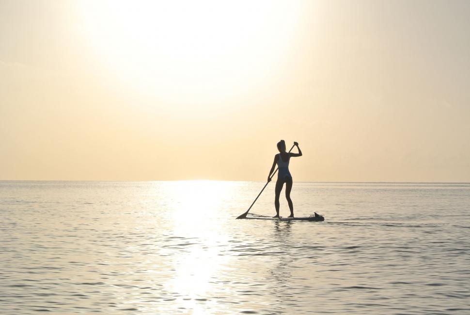 Free Image of Paddleboarding at golden hour 