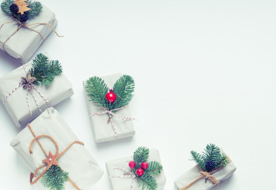 Free Image of Festive wrapped Christmas gifts with natural decor 