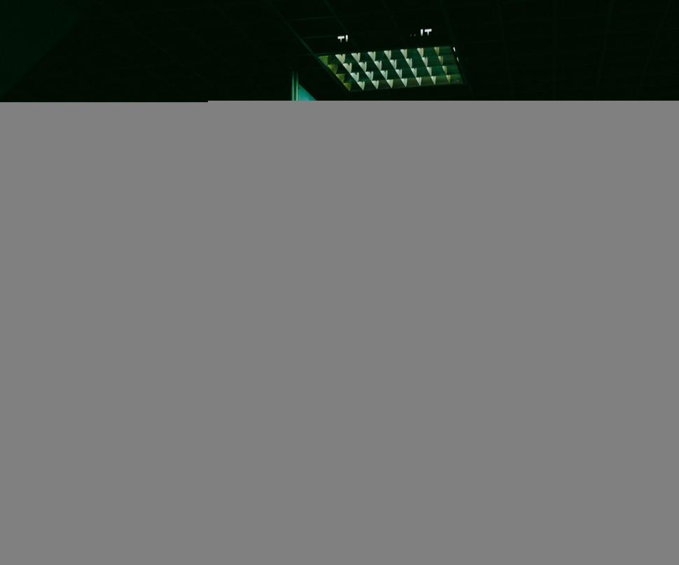 Free Image of Alone person waiting at the dimly lit station 