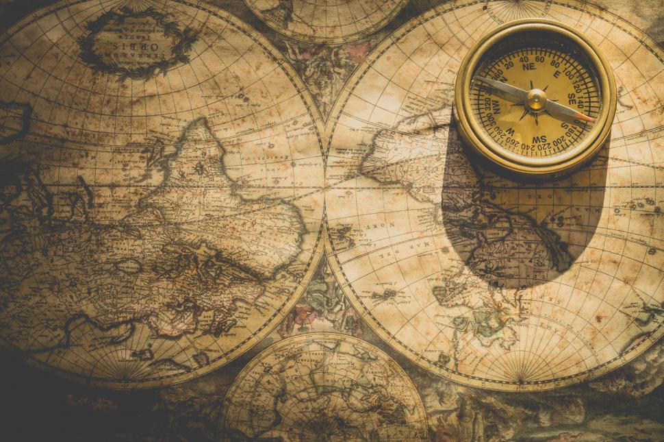Free Image of Vintage compass on an ancient world map 
