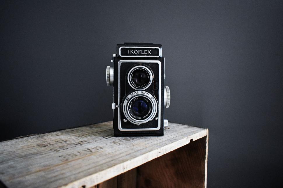 Free Image of Vintage Ikonflex camera on a wooden table 