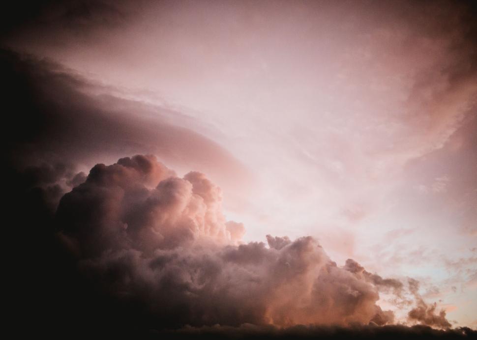 Free Image of Dramatic cloudscape with pink and purple hues 