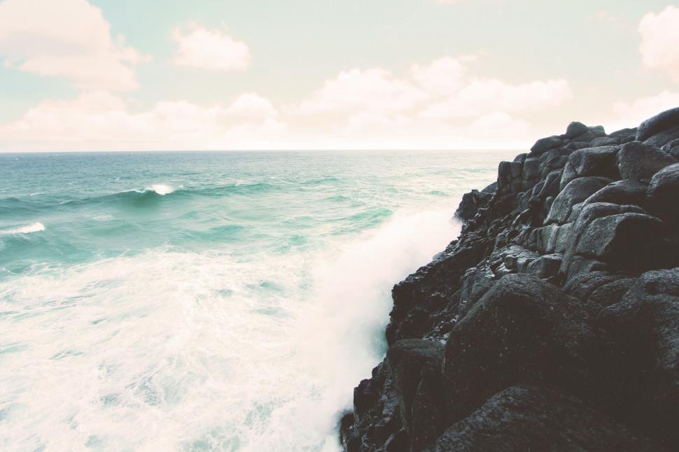 Free Image of Vintage-toned seascape with crashing waves 