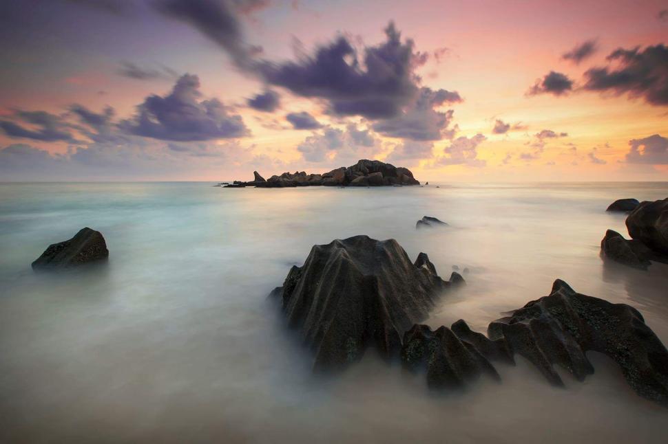 Free Image of Soothing seascape with rocks at dusk 