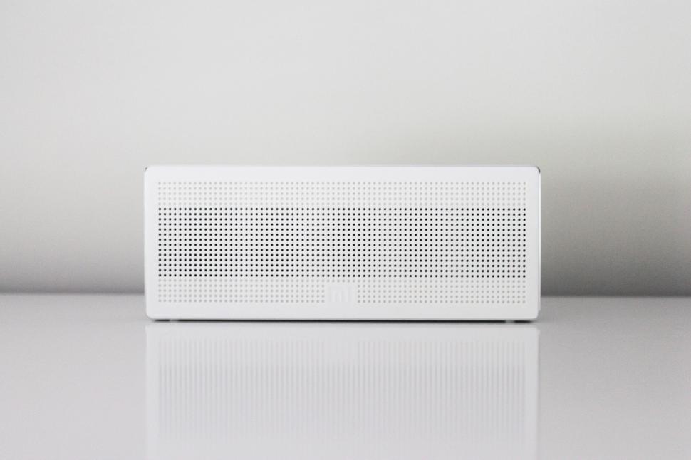 Free Image of White portable speaker on a white surface 