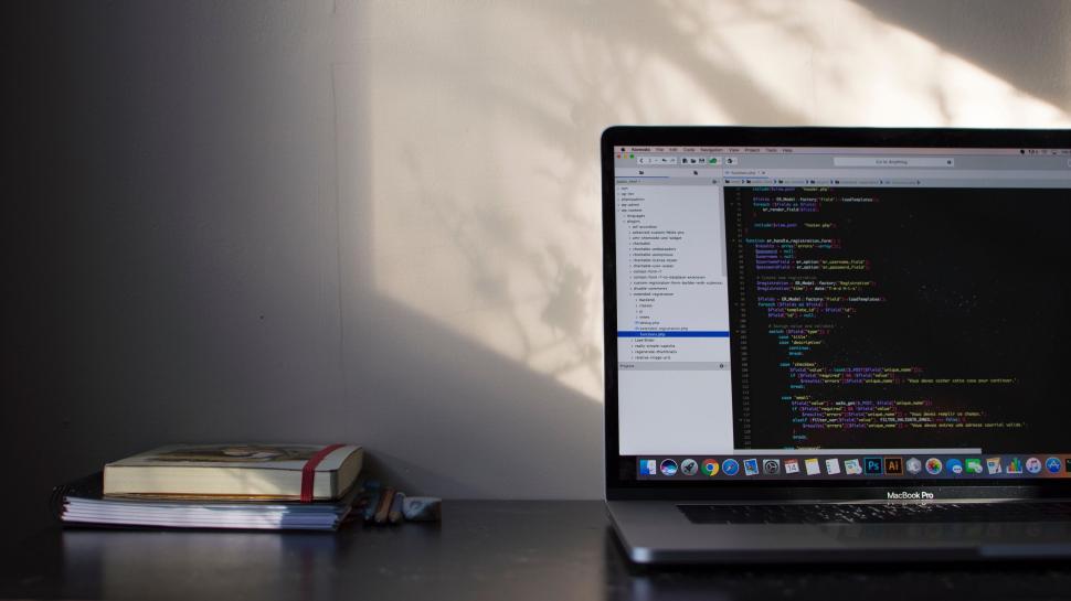 Free Image of Laptop with code on screen 