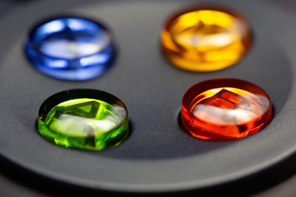 Free Image of Colorful gemstones on a dark surface 