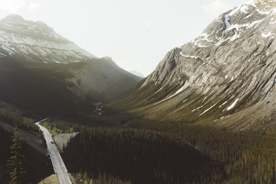 Free Image of Mountain road winding through forest 