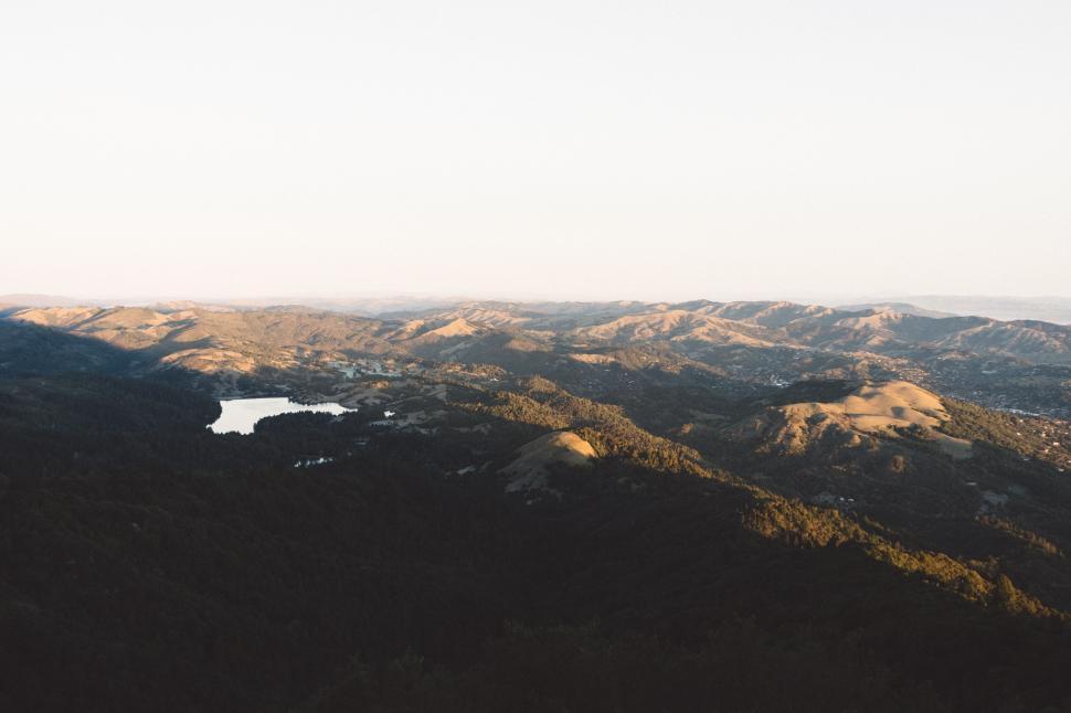 Free Image of Golden Hour Over Hilly Landscape 