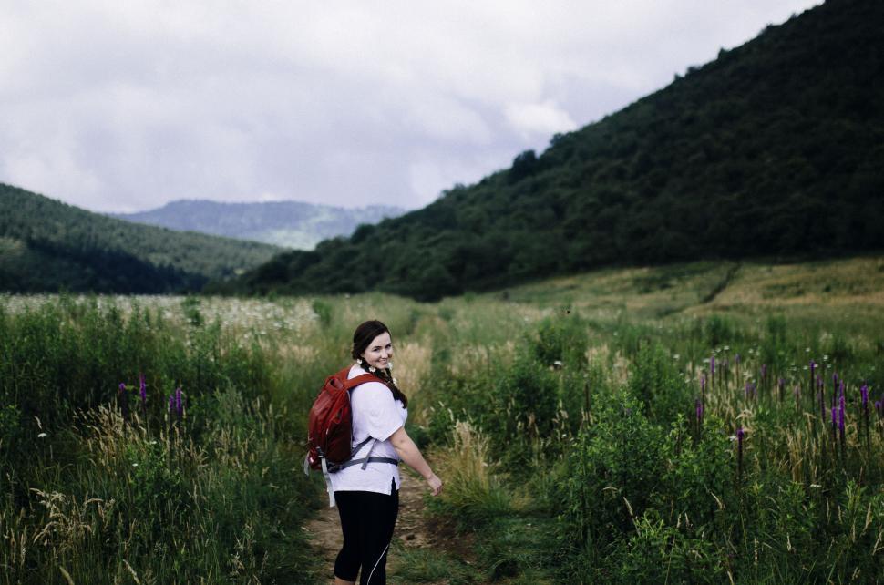 Free Image of Hiker on a mountain trail with backpack 