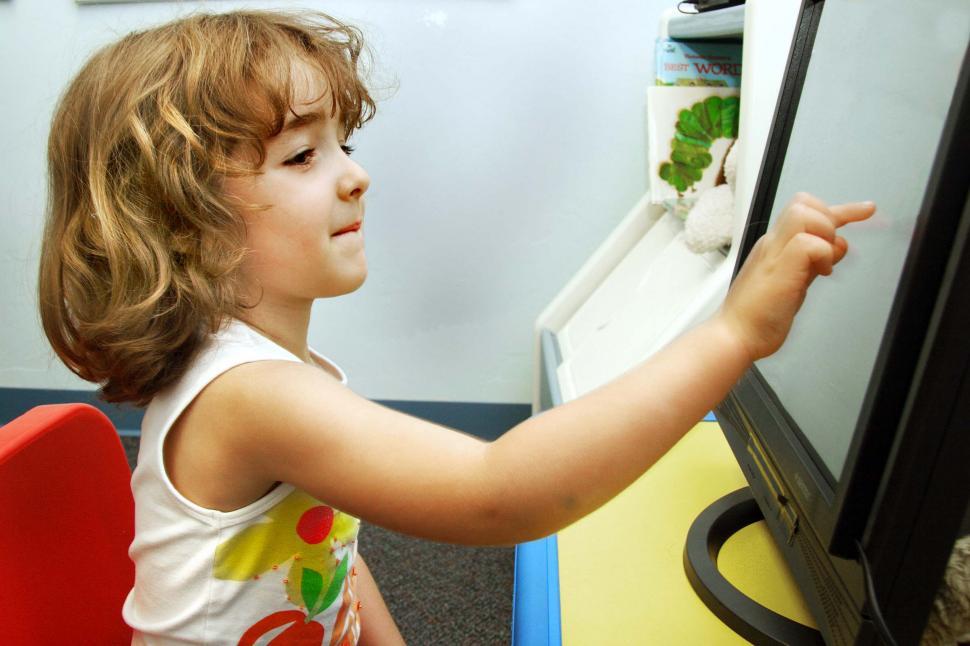 Free Image of Child and touchscreen 