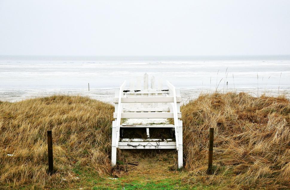 Free Image of Beach lookout post against cloudy skies 