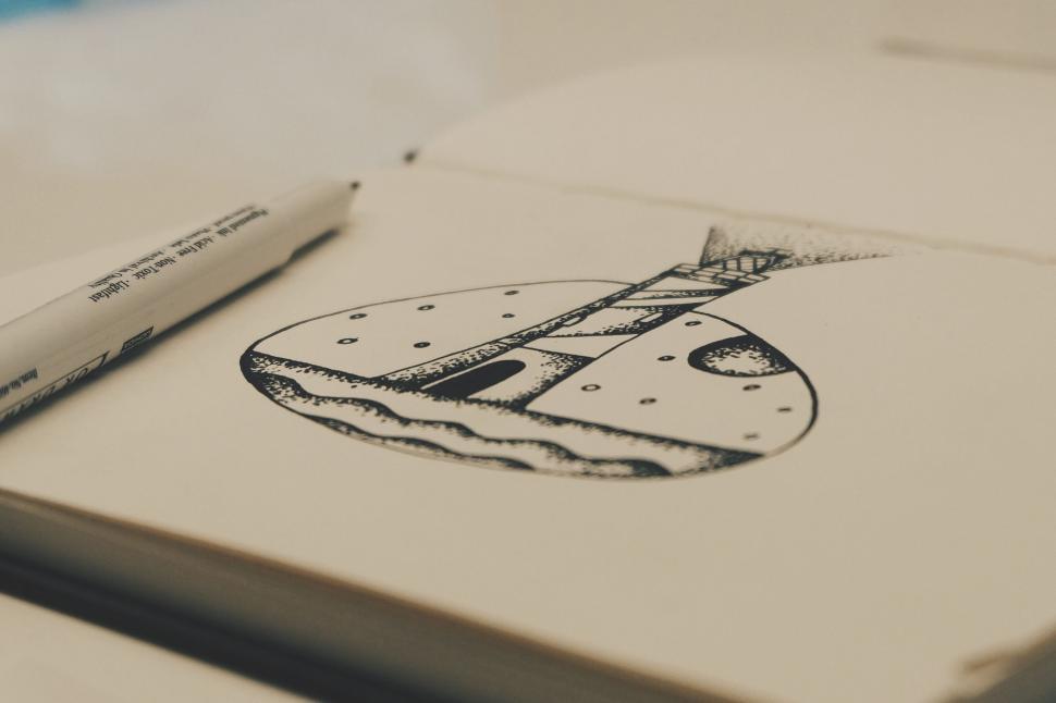 Free Image of Hand-drawn spaceship in sketchbook 
