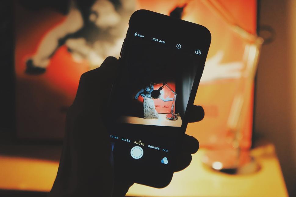 Free Image of Phone capturing a graffiti artwork 