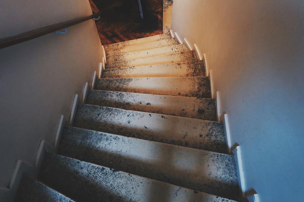 Free Image of Dimly lit staircase with shadows 