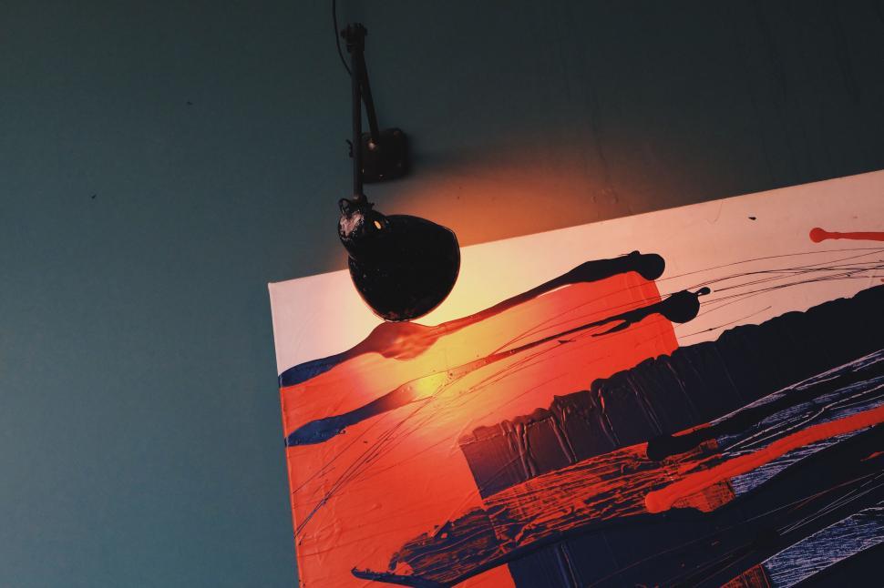 Free Image of Shattered guitar hanging on a wall 