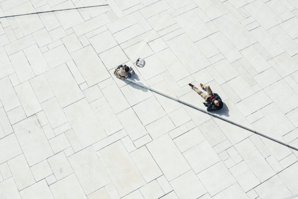 Free Image of Aerial view of people relaxing on a square 