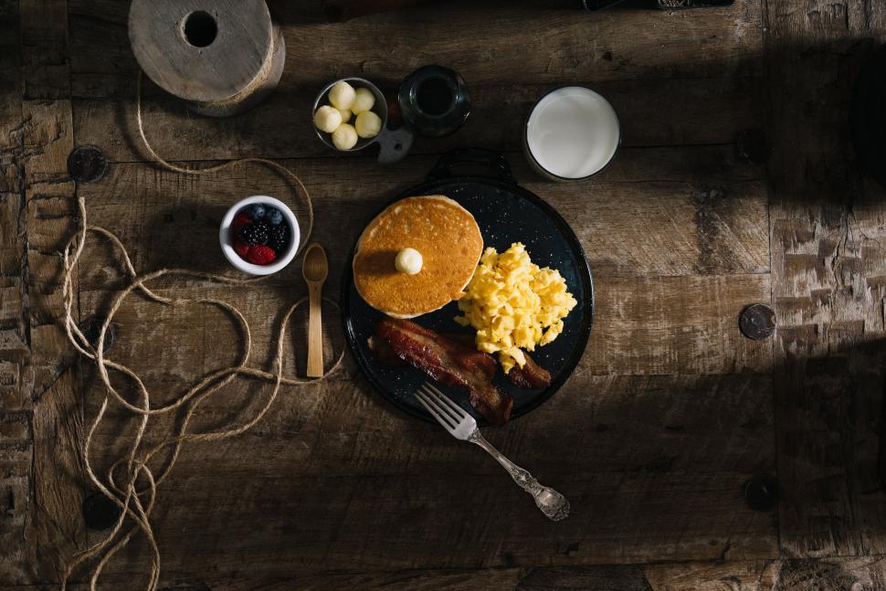 Free Image of Rustic Breakfast with Pancakes and Eggs 