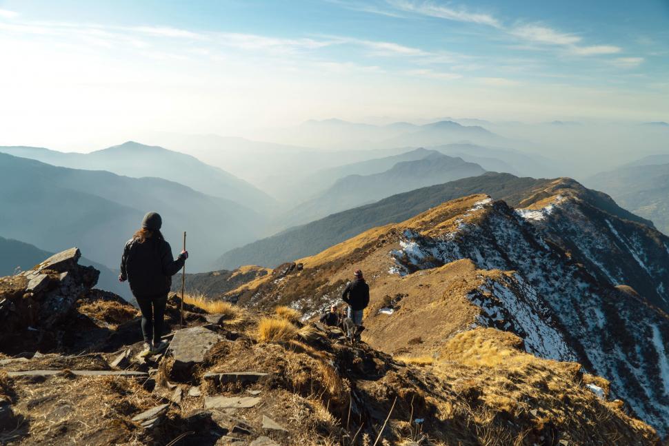 Free Image of Hikers on mountain trail at sunset 