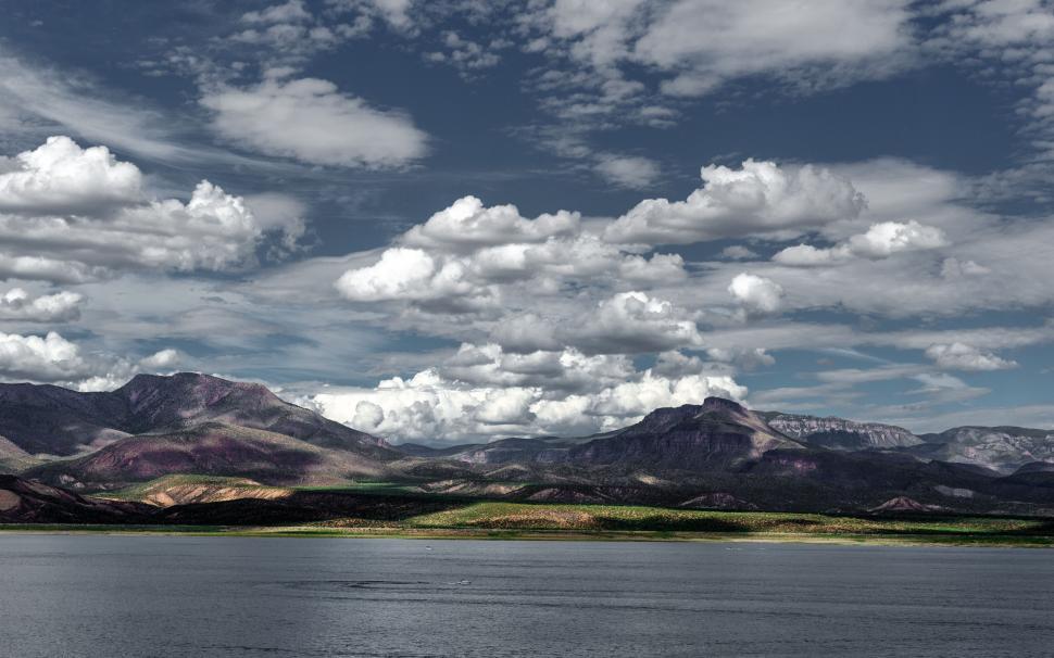 Free Image of Dramatic sky over a mountainous landscape 