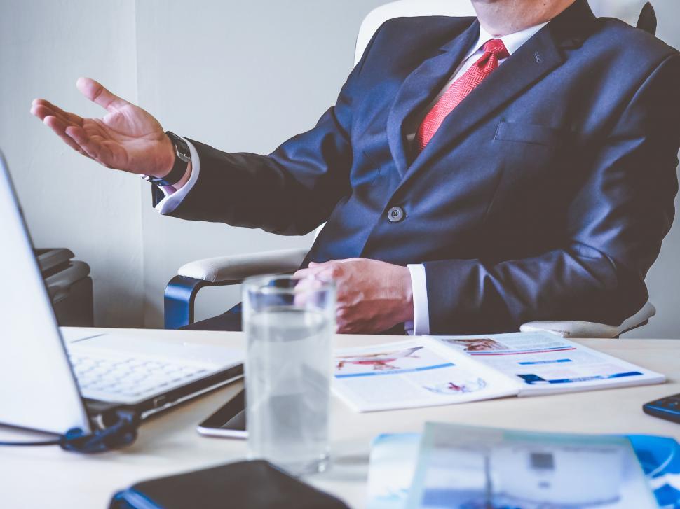 Free Image of Businessman presenting in office with laptop 