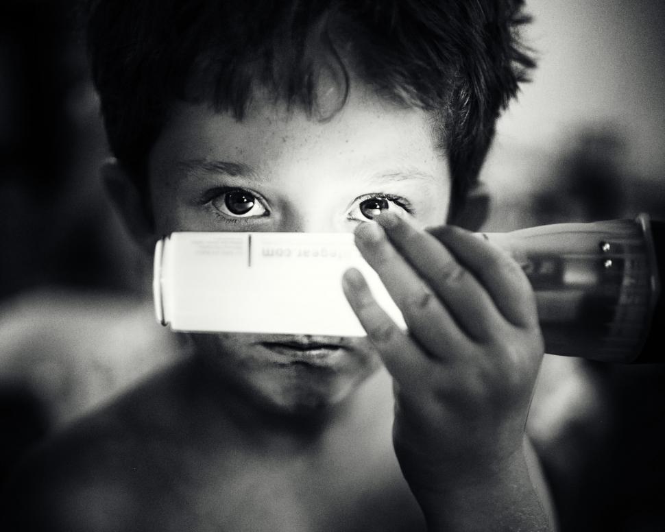 Free Image of Person holding an object with blurred face 