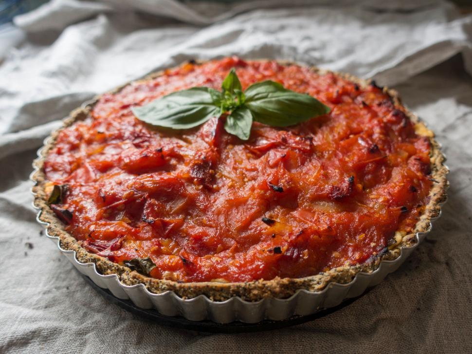 Free Image of Homemade tomato pie on grey fabric 