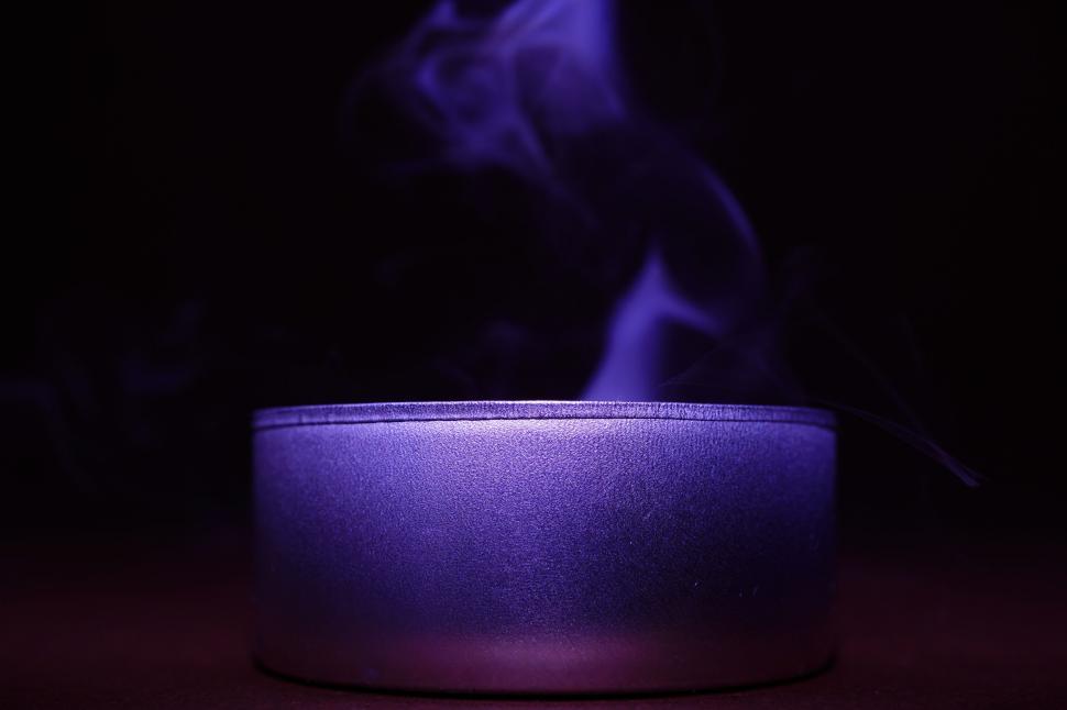 Free Image of Mysterious smoke emanating from metallic container 