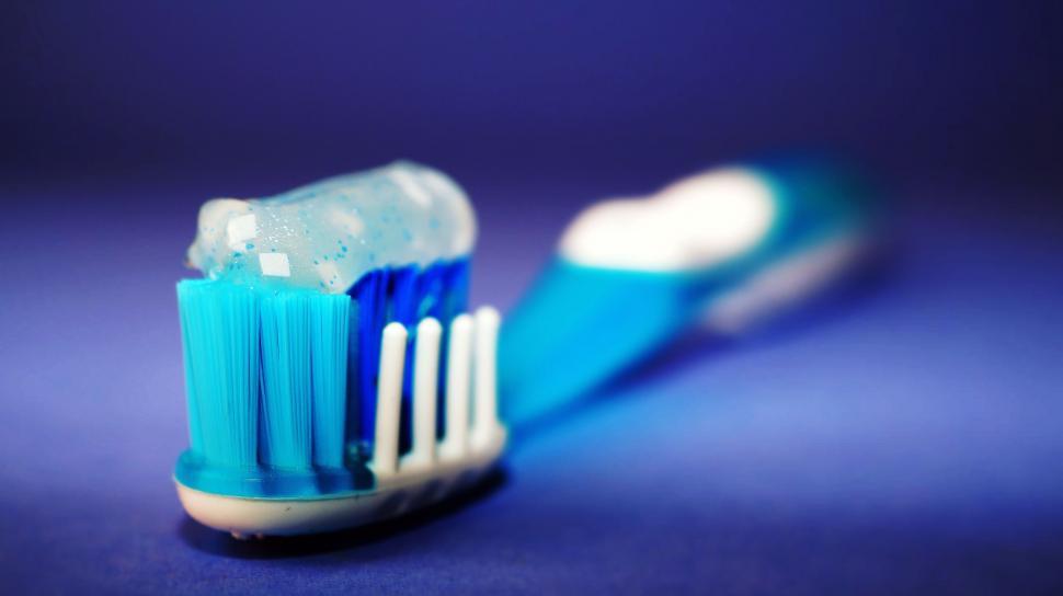 Free Image of Toothbrush with blue toothpaste 
