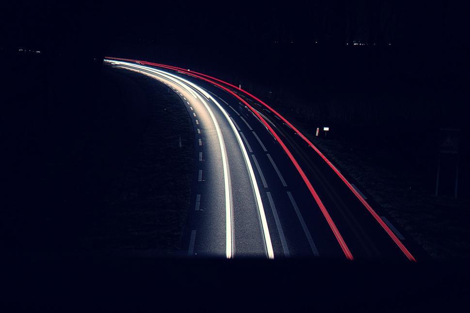 Free Image of Long exposure of highway traffic at night 