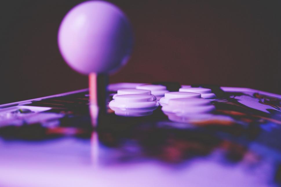 Free Image of Close-up of a joystick on a colorful board 